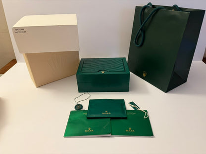 Elegant watch box with gift packaging including bag and presentation items