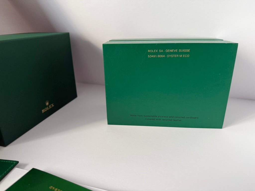 Luxury watch box exterior view showing smooth green surface and design