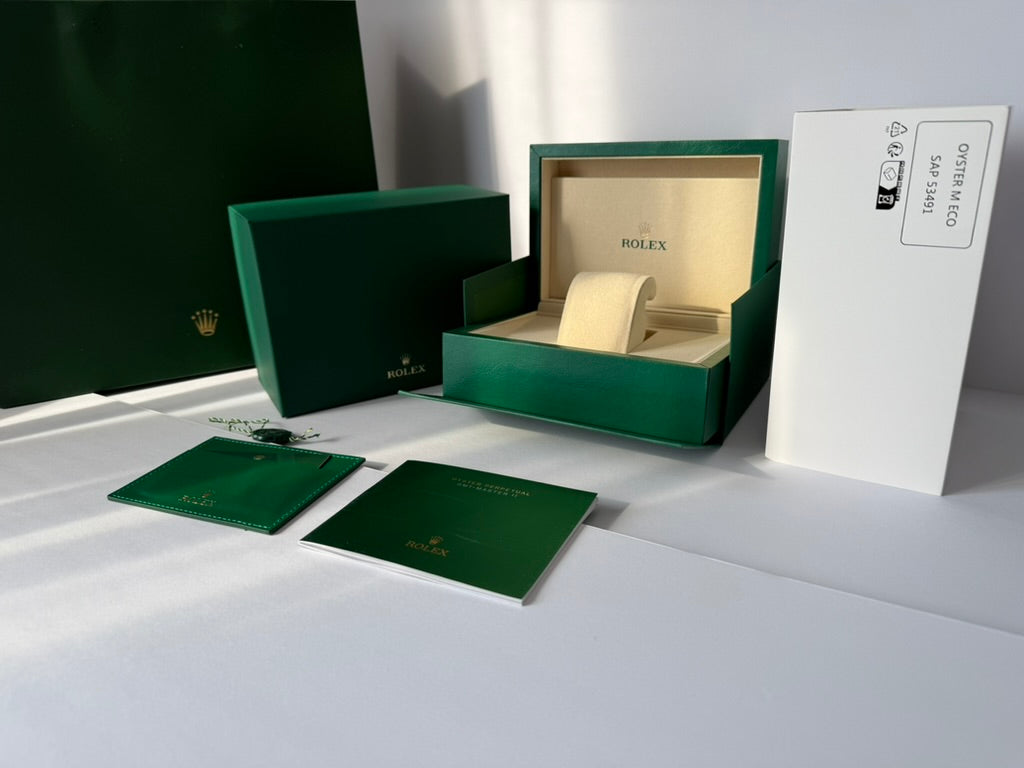 Luxury watch case with accessories and premium green exterior finish